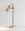 Finish:Antique Brass|||Stone:Travertine|||Spot Desk Light in antique brass with travertine base