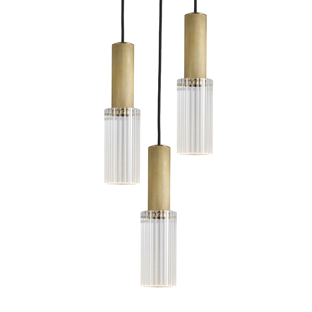 Triple grouping of the Flume 80 Pendant Light in antique brass with clear reeded glass